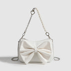 Pearl Chain Bow Underarm Bag side view with pearl chain strap
