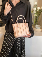 Women wearing top handle crossbody bag with adjustable shoulder strap