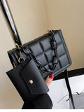 Black quilted chain strap crossbody bag front view