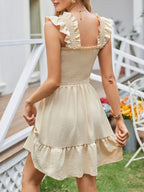 Close up of smocked texture on square neck dress