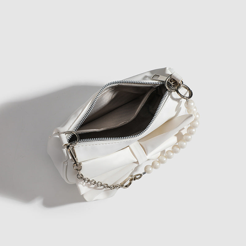 Close up of bow detail on Pearl Chain Underarm Bag