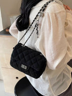 Women wearing a stylish quilted chain crossbody bag

