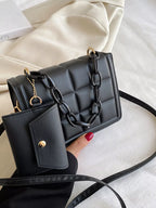 Quilted texture detail on black crossbody bag